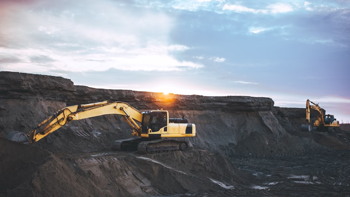 Excavators operating in a large open-pit mining site